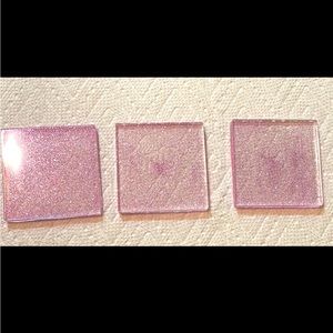 3 purple homemade sparkly epoxy coasters